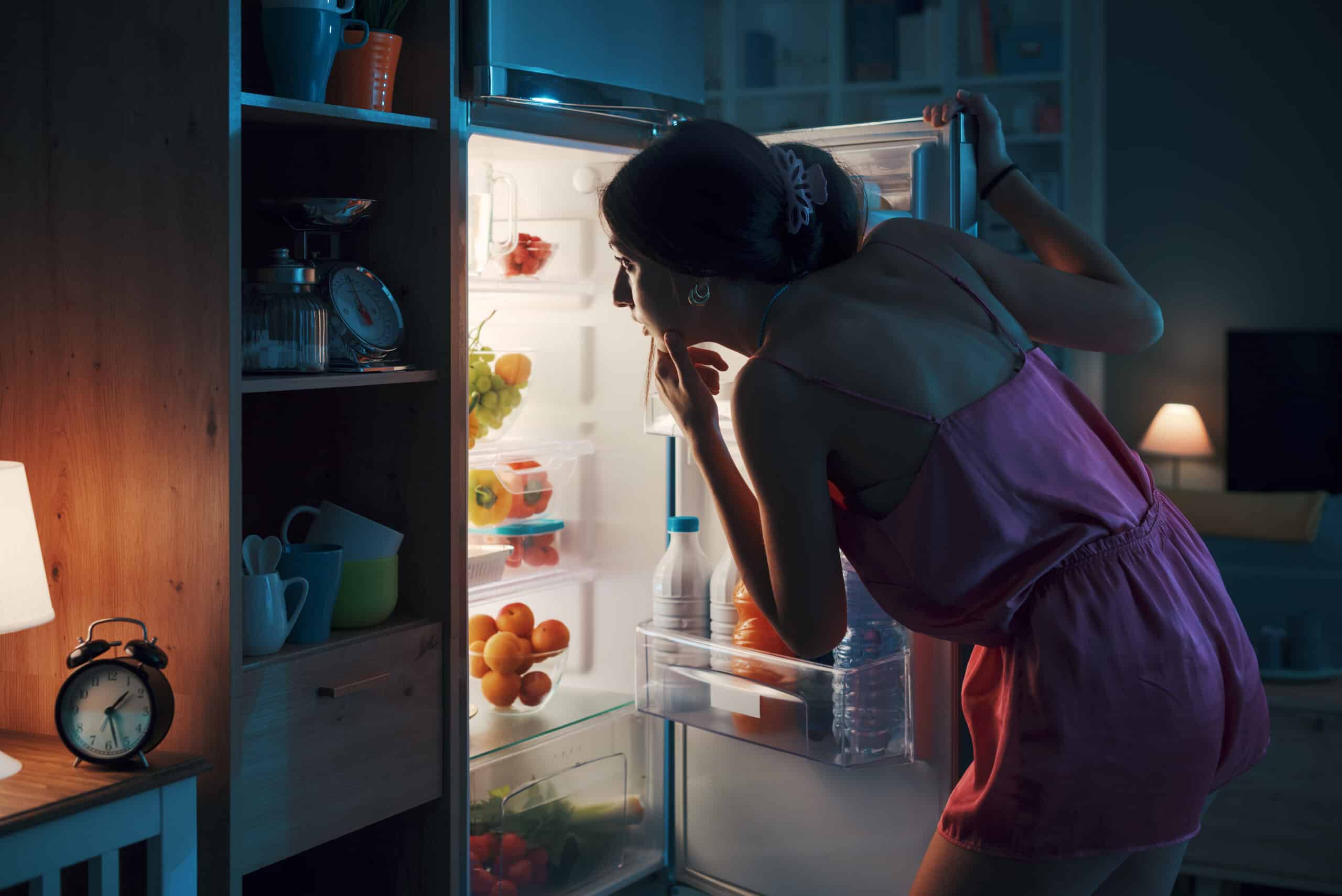 Woman looking in the fridge